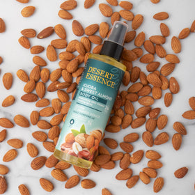 Desert Essence bottle staged with other skincare to show daily routine benefit