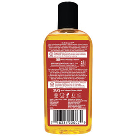 Label close-up on Desert Essence bottle highlighting cold-pressed purity