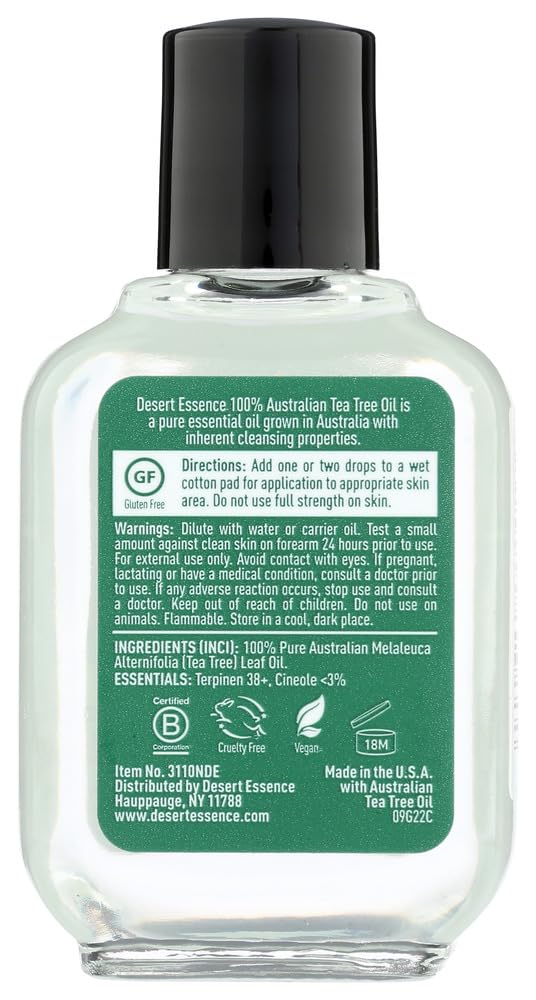 Desert Essence tea tree oil dropper dispensing a drop demonstrating controlled application