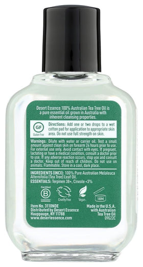 Desert Essence tea tree oil dropper dispensing a drop demonstrating controlled application