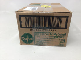 Dettol bar in hand for scale showing compact travel-friendly size