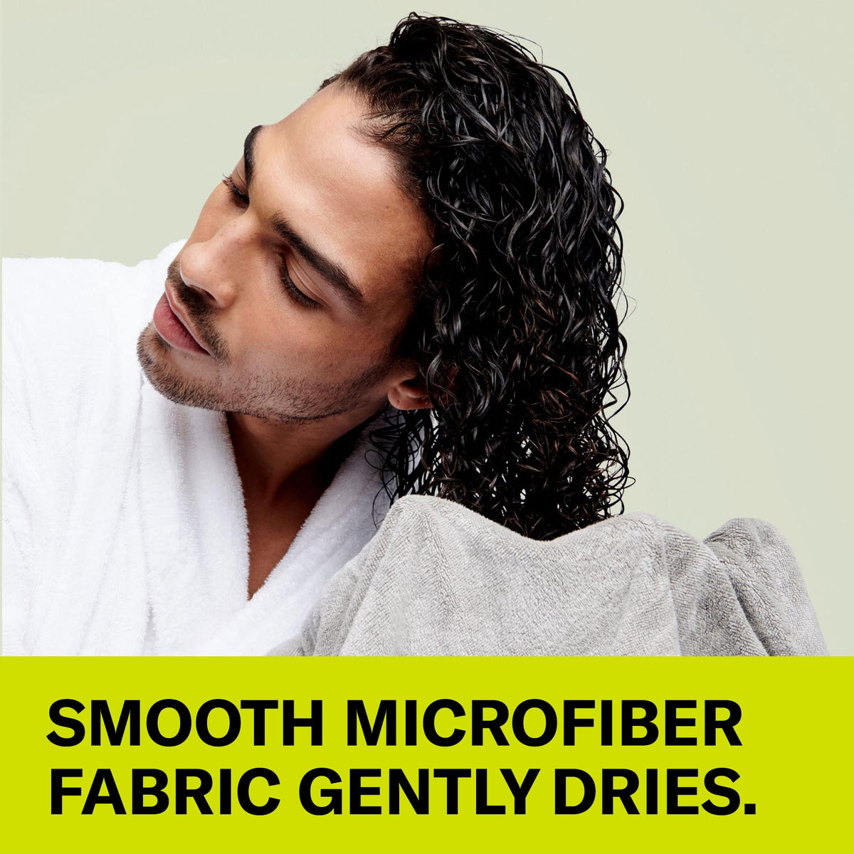 DevaCurl towel in use scrunching wet curls to reduce frizz