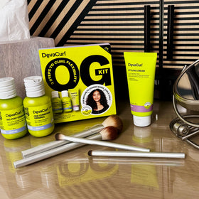 DevaCurl One Condition cream texture on palm showing slip and moisture