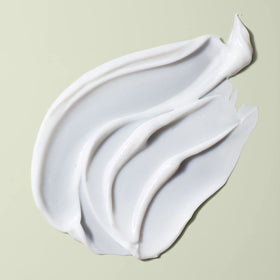 DevaCurl rich cream texture close-up demonstrating thick moisture-rich formula