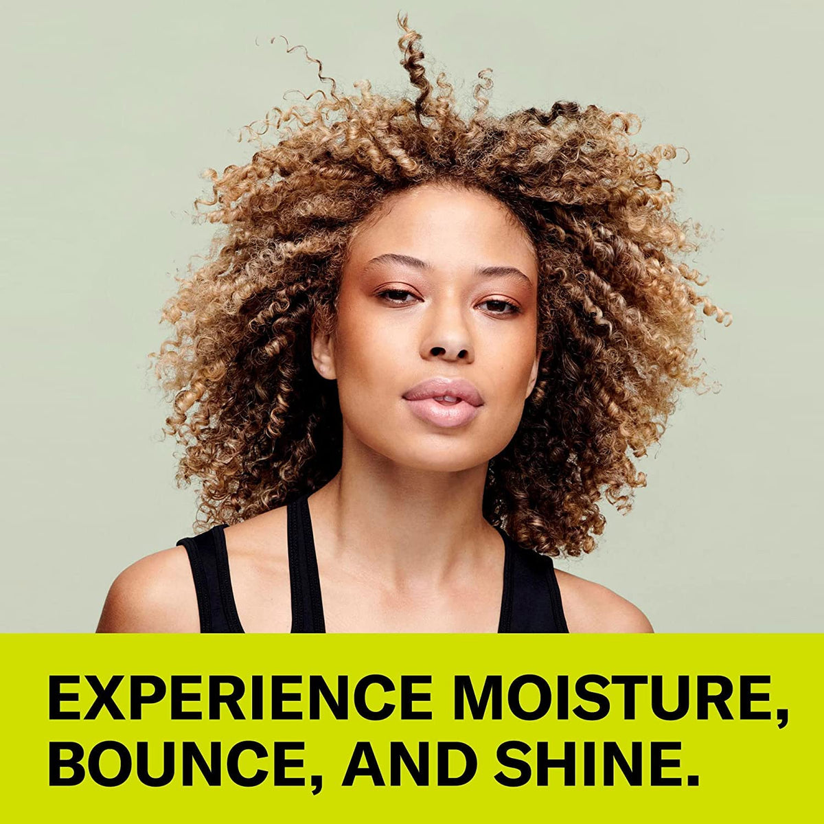 DevaCurl application on damp curls demonstrating added body and manageability
