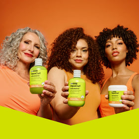 DevaCurl size comparison in hand illustrating 12 oz bottle for travel-friendly reference