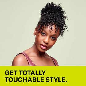 DevaCurl cream being dispensed showing easy application and frizz control