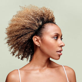 DevaCurl on wet curly hair reducing knots and enhancing curl shape