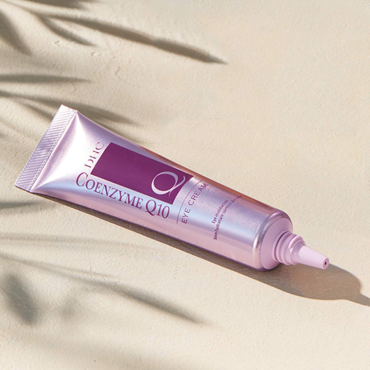 DHC CoQ10 eye cream on bathroom vanity with other skincare for routine-ready use