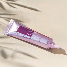 DHC CoQ10 eye cream on bathroom vanity with other skincare for routine-ready use