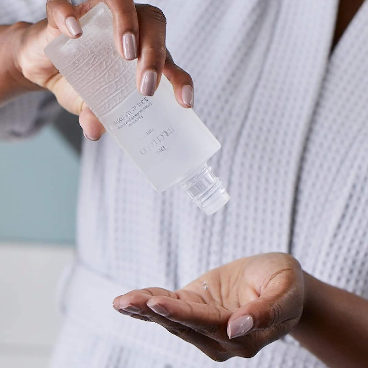 DHC lotion applied on hands demonstrating easy layering benefit