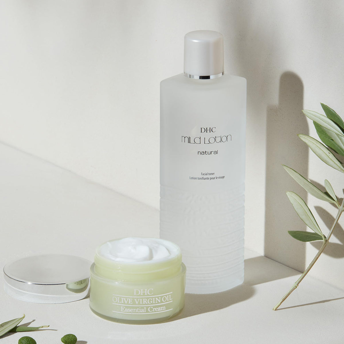 DHC bottle next to measuring scale indicating 6 fl. oz. size benefit