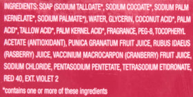 Close-up of Dial Power Berries soap bar texture highlighting glycerin sheen and specks