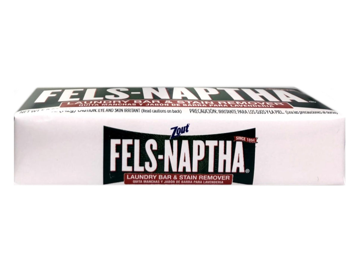 Dial Purex Fels-Naptha bar next to folded clothes showing compact size benefit