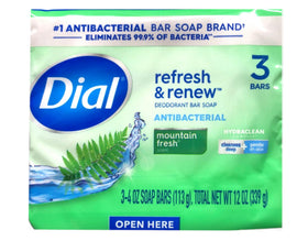 Dial soap held in hand comparing size for portability benefit