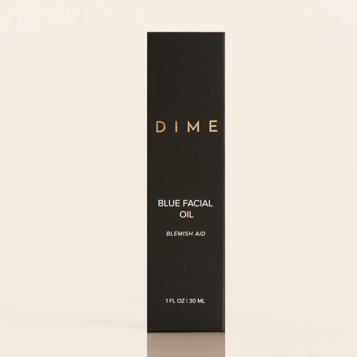 DIME blue facial oil staged in nighttime routine showing easy evening integration