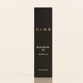 DIME blue facial oil staged in nighttime routine showing easy evening integration