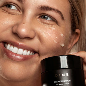 DIME cleansing balm emulsified with water showing milky rinse for easy removal