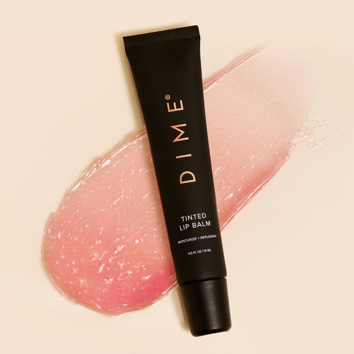 DIME Desert Rose on bedside table suggesting nighttime lip repair routine