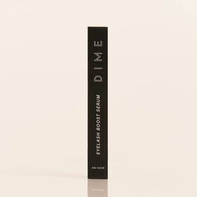 DIME serum next to mascara and brow gel suggesting layered lash system