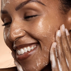 DIME cleanser on bathroom counter during morning routine supporting simple layering