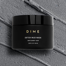 DIME close-up of mask texture displaying creamy mineral-rich consistency for gentle exfoliation
