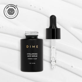 DIME dropper detail releasing serum drop, highlighting precise application benefit