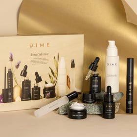 DIME travel kit in pouch on a dresser illustrating convenient, travel-ready skincare