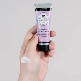 Dionis tube in hand showing 1 oz travel size for portability and convenience