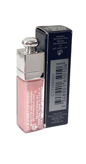 Dior Addict texture swatch on skin showing glossy finish and sheer pink tint