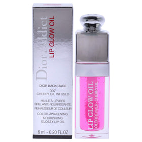 Dior lip glow oil front packaging showing compact 0.2 oz tube and raspberry tint benefit