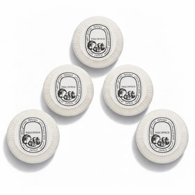 Diptyque Philosykos pleat-wrapped five-bar set presented neatly for elegant gifting
