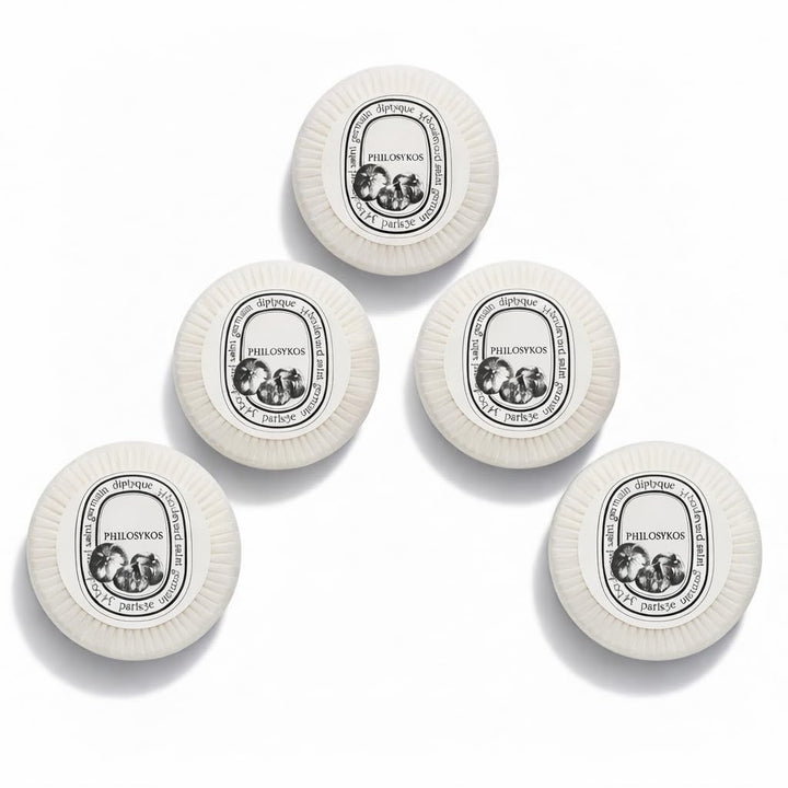 Diptyque Philosykos pleat-wrapped five-bar set presented neatly for elegant gifting