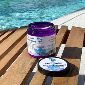 Diva Stuff applying lotion to arm before swim to reduce chlorine exposure