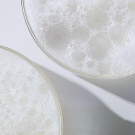 Divi label closeup focusing on ingredient list and cruelty-free badge