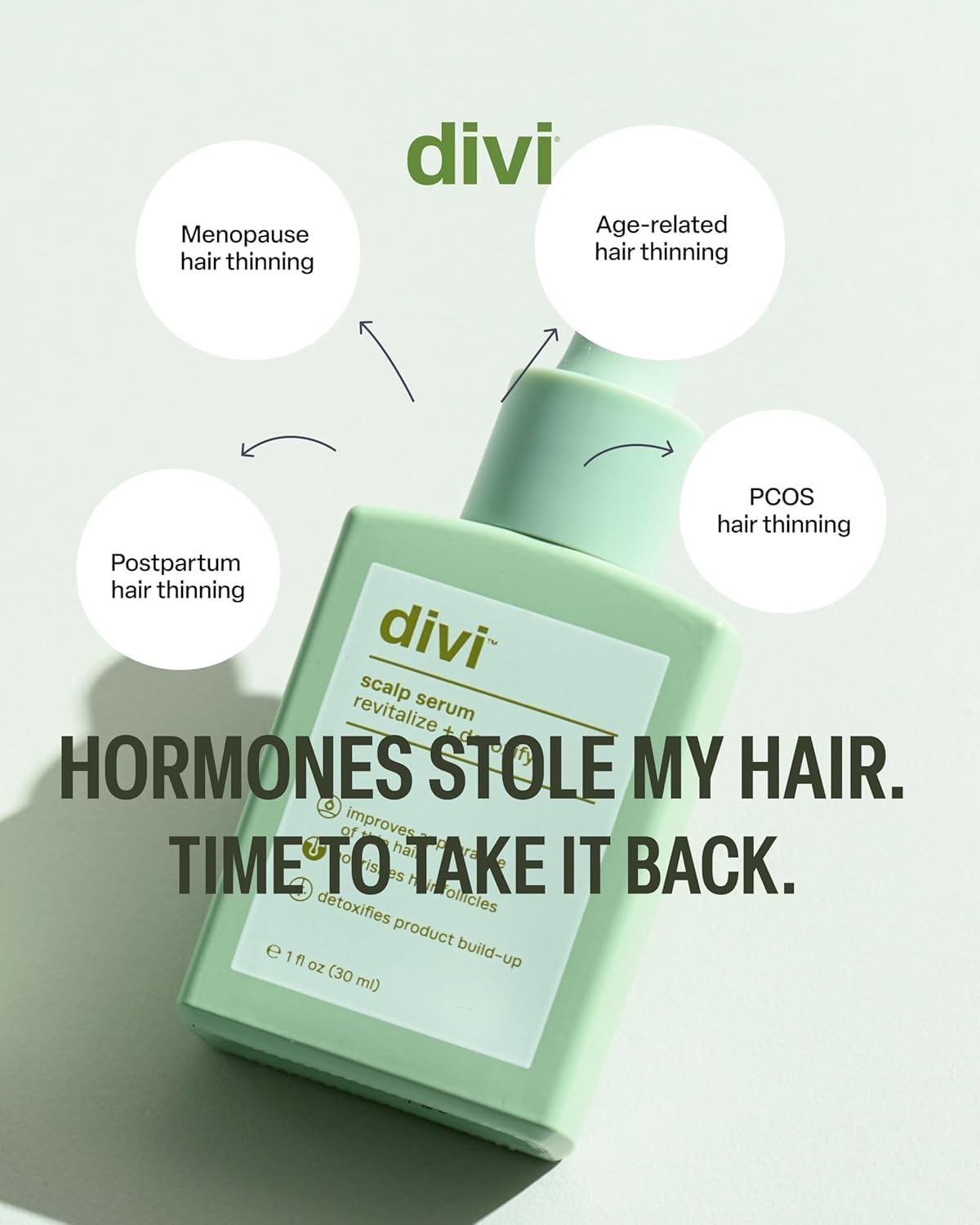 divi bottle held in hand for scale, shows compact travel-friendly size benefit