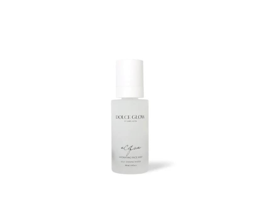 Dolce Glow self-tanning mist nozzle close-up showing fine spray for streak-free color