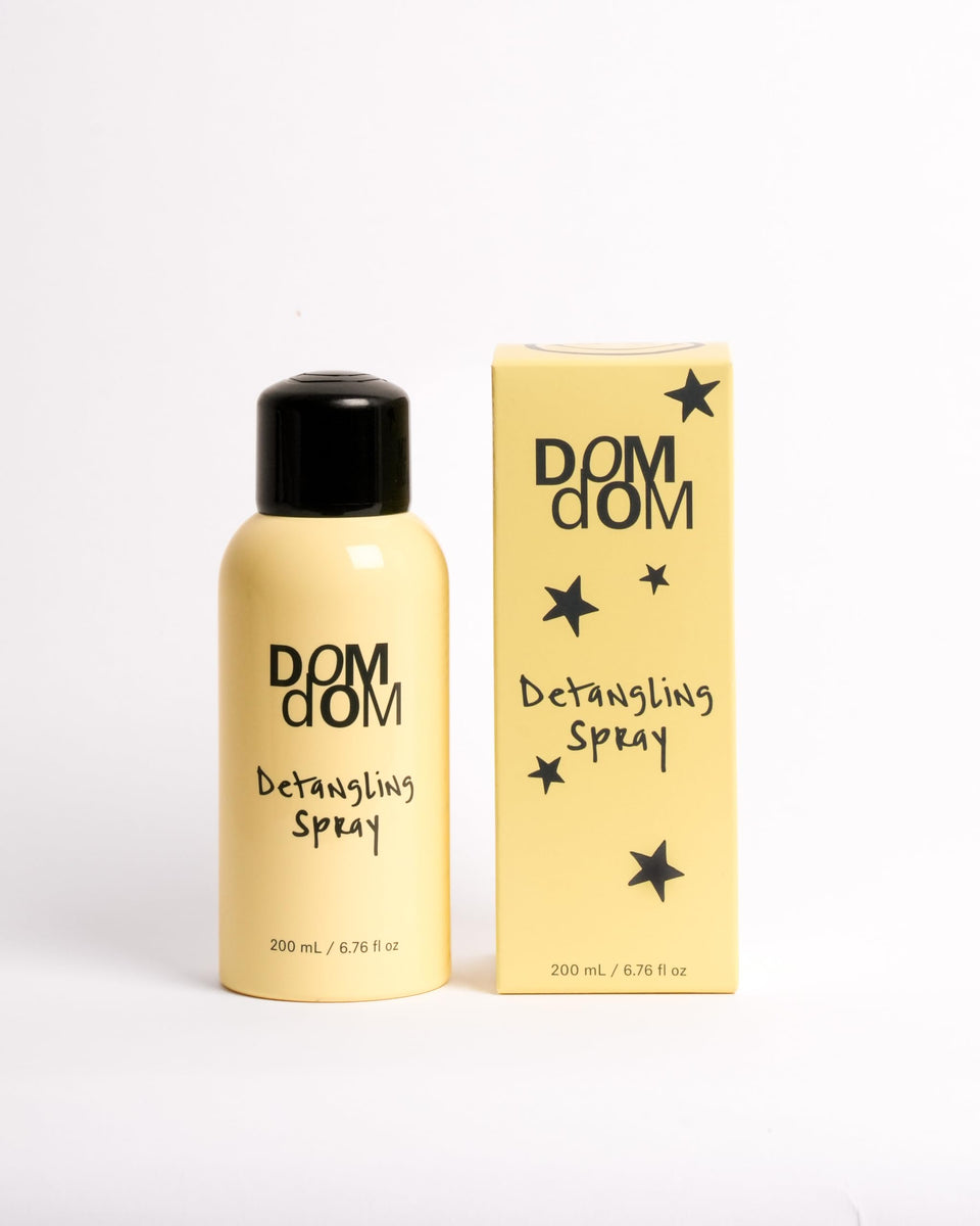 Dom Dom front bottle view showing label and volume, clear product benefit