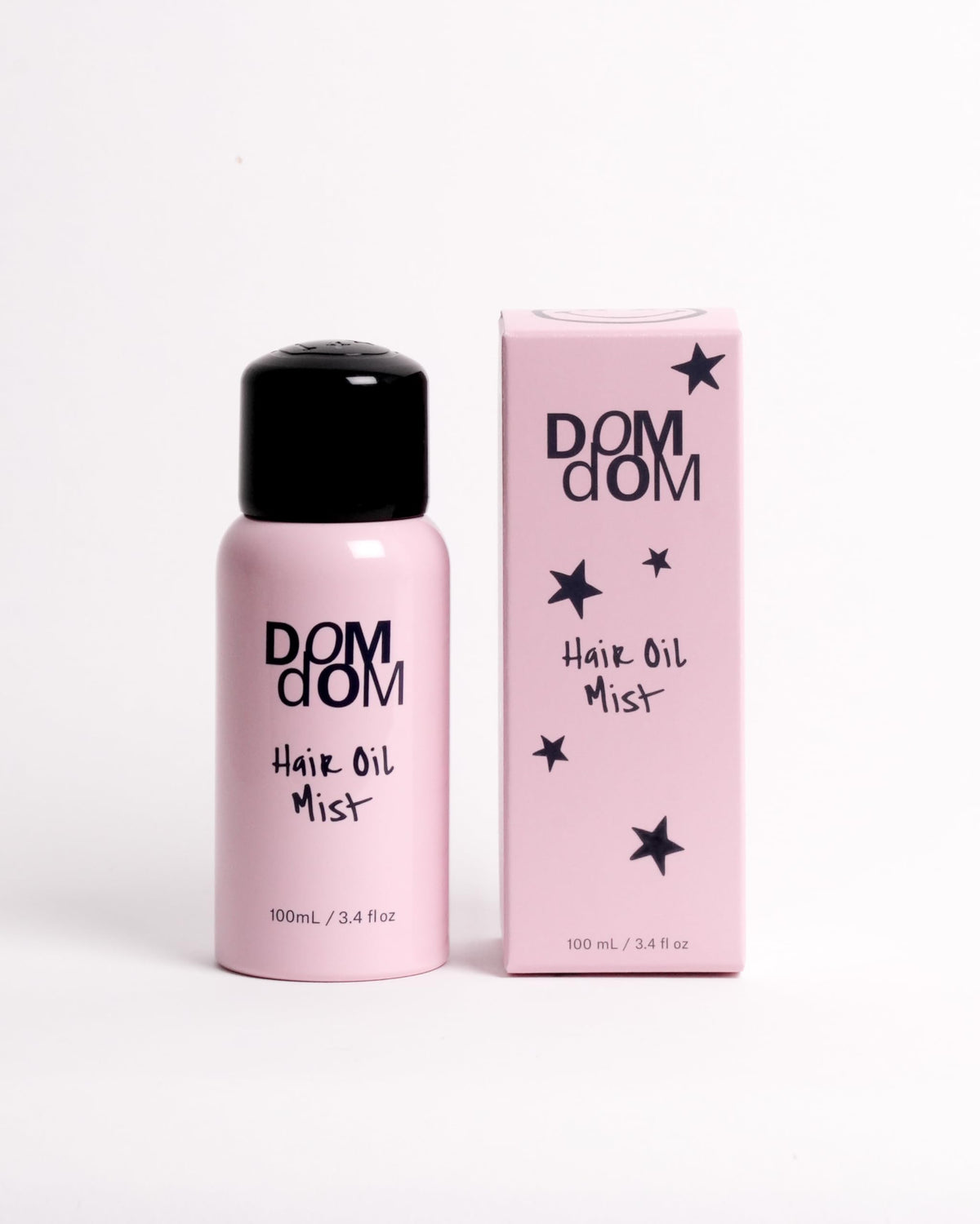 Dom Dom front bottle view showing label and compact 3.4 fl oz size for travel