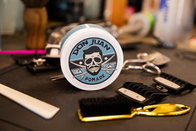 Don Juan 4 oz jar next to everyday items to show compact travel size