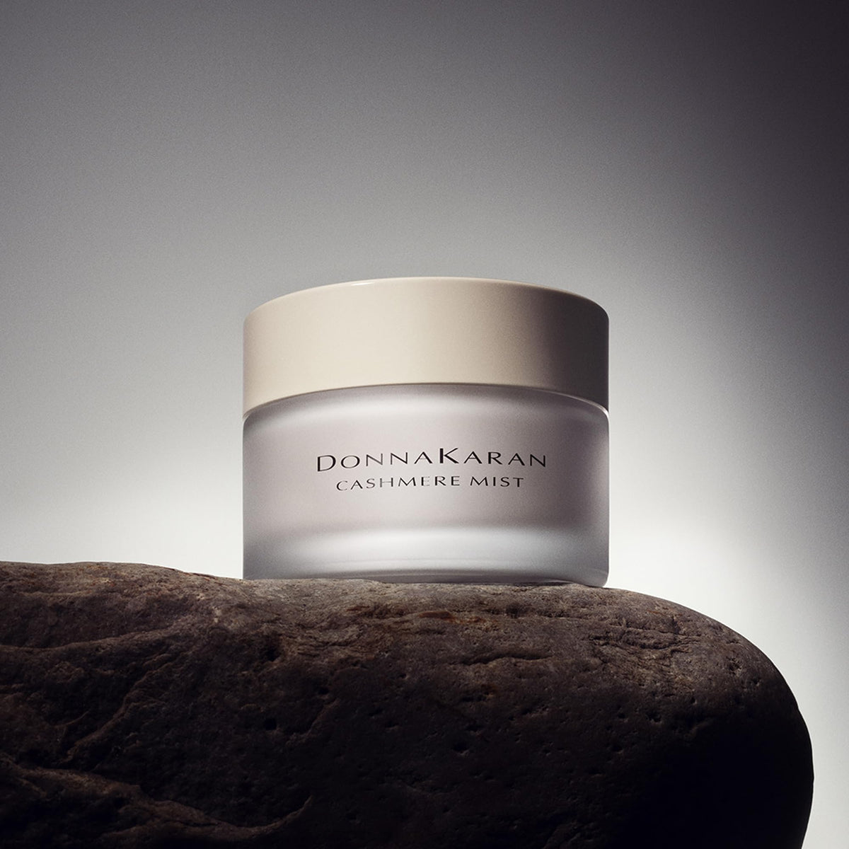 Donna Karan Cashmere Mist being smoothed into skin demonstrating instant softening