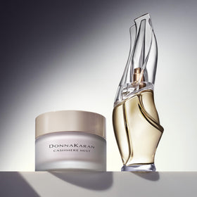 Donna Karan Cashmere Mist next to common items to show 5.9 fl oz scale