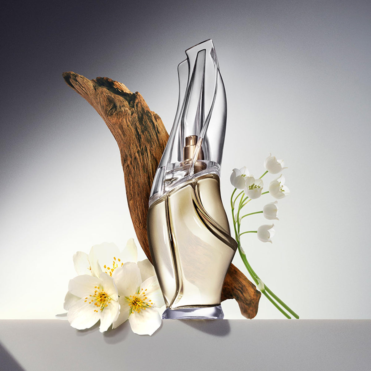 Donna Karan Cashmere Mist creamy texture close-up illustrating fast absorption benefit