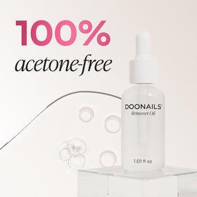 DOONAILS beside a coin for scale emphasizing travel-size convenience