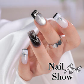 Double Rhythm finished nail art on hands demonstrating wearable cat eye and glitter design