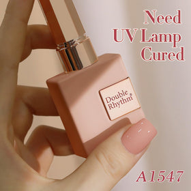Double Rhythm size comparison hand demonstrating 15ml bottle scale and portability
