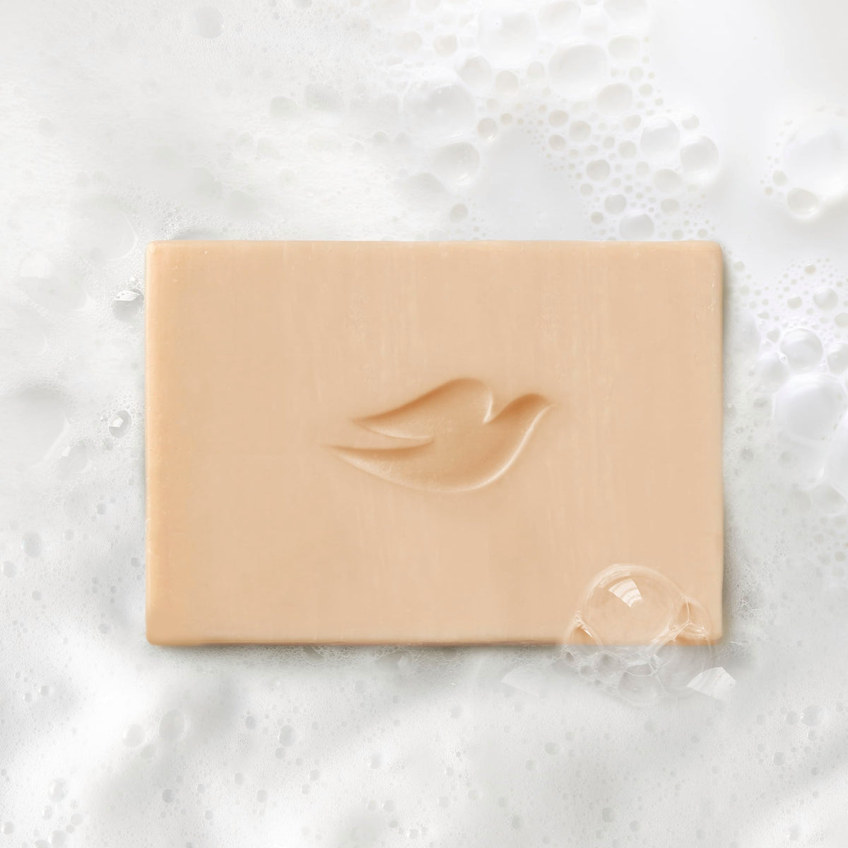 Dove bar on shower shelf suggesting a fragrant, elevated shower