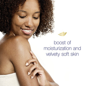 Person holding Dove in palm, demonstrating soft skin and gentle cleansing