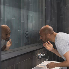Dove Men+Care bundle in a bathroom setting illustrating easy travel-ready skincare routine