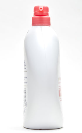 Dove bottle in shower lifestyle scene showing invigorating use and fresh fragrance benefit